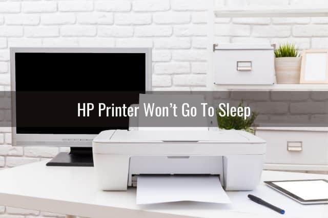 White printer and desktop monitor that is off