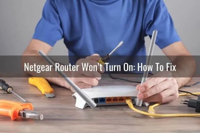 Man with tools and fixing a white router