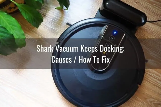 Robotic vacuum at docking station charging
