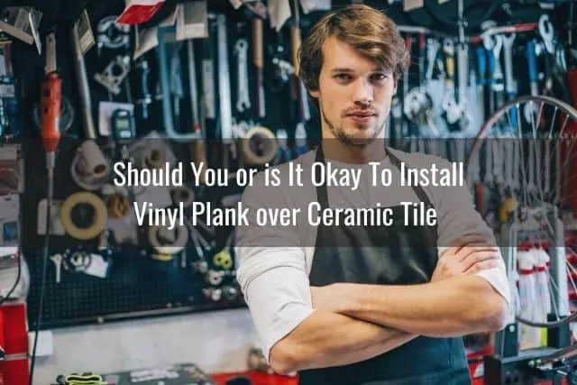 Guy with a wall of tools behind him