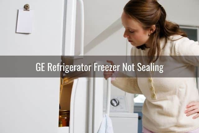 Woman opening refrigerator door taking peek inside
