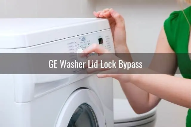 Hand pushing washing machine button