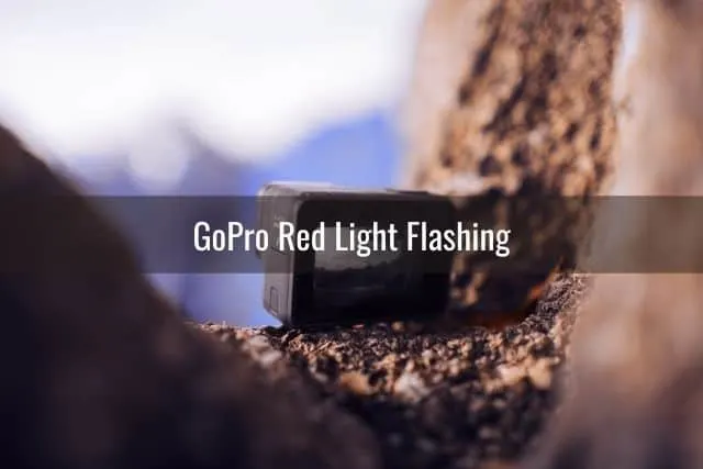 GoPro camera sitting between two rocks