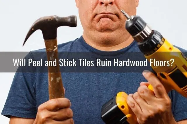 A man with a hammer and power drill in hand