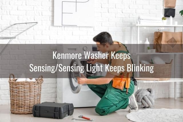 Handyman repairing washing machine