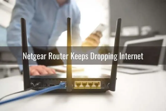 The back of a router and a person searching for a WiFi signal on his phone