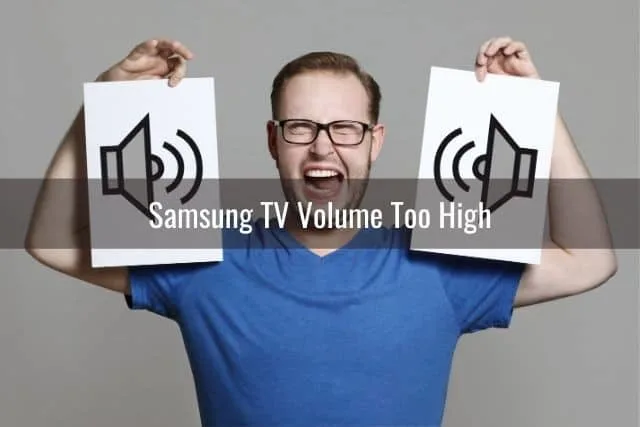 Man holding pieces of paper with speaker images on them