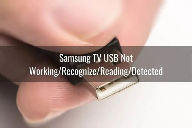 Hand holding USB cable