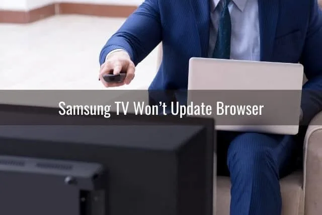 Businessman changing TV channels with remote