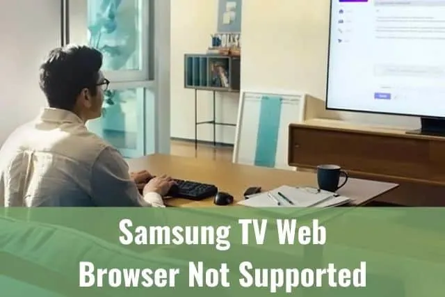 Guy typing keyboard and looking at TV screen
