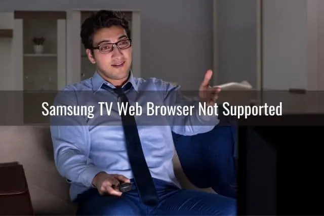 Annoyed businessman watching TV