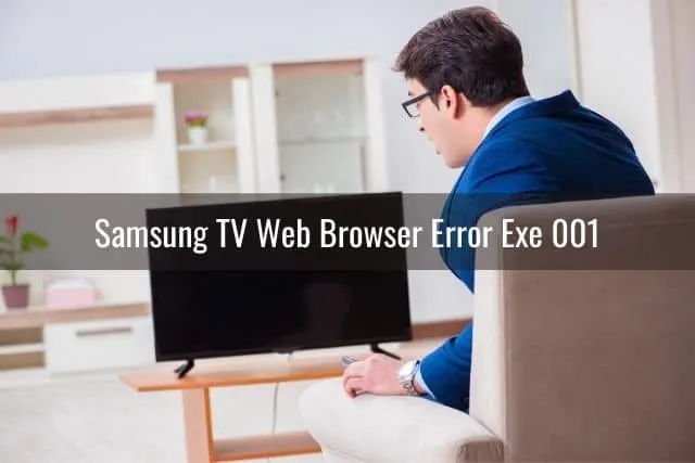 Businessman trying to fix TV