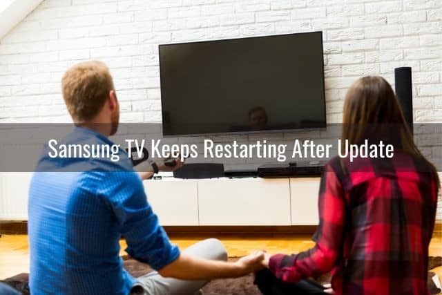 A couple staring at a black TV screen