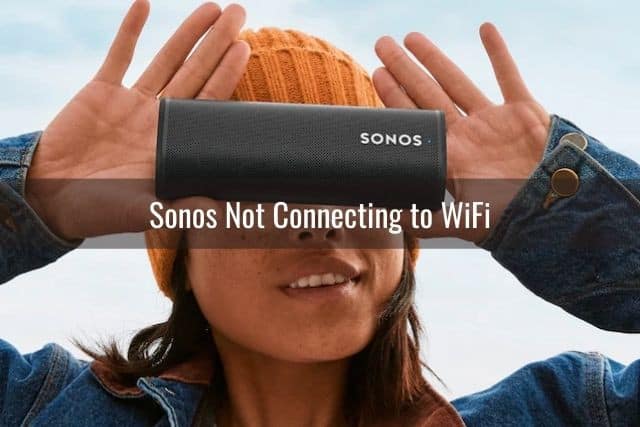 Girl holding small portable speaker