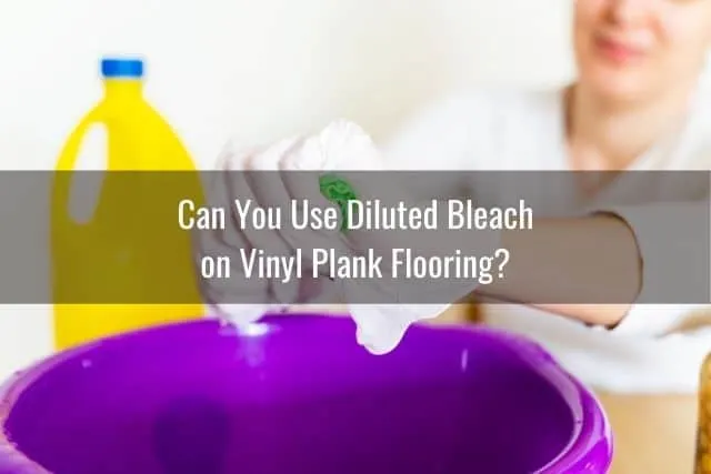 A cleaning sponger being writhed out over bucket