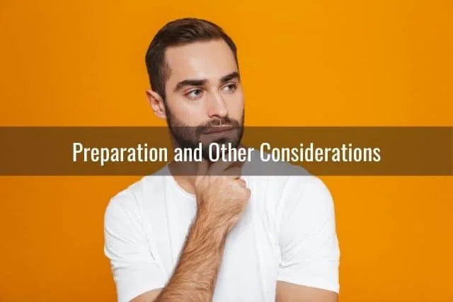 Male thinking with orange wall background