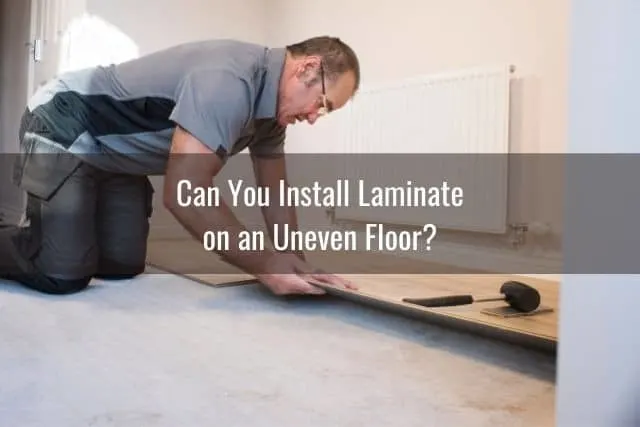 Man installing laminate flooring