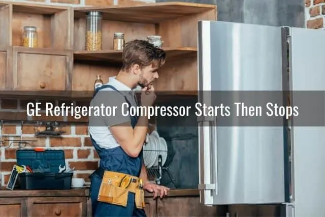 Repairman looking at refrigerator problem
