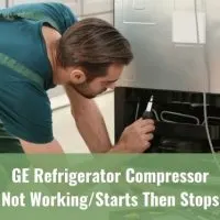 Repairman fixing fridge