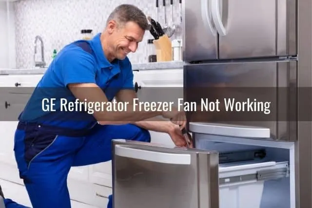 Repairman fixing fridge freezer