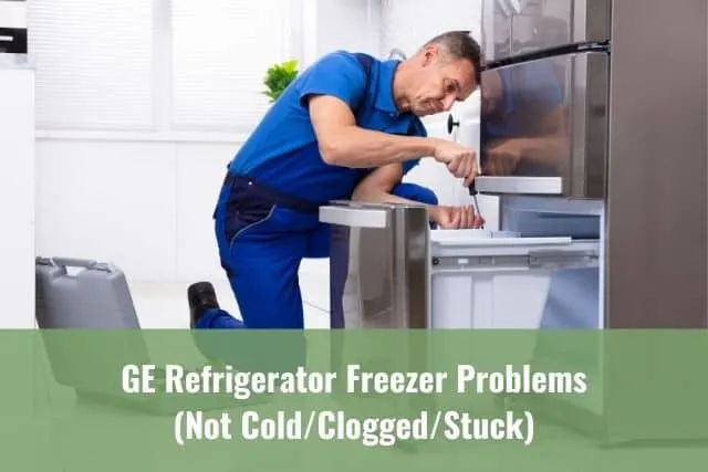 Repairman fixing refrigerator freezer