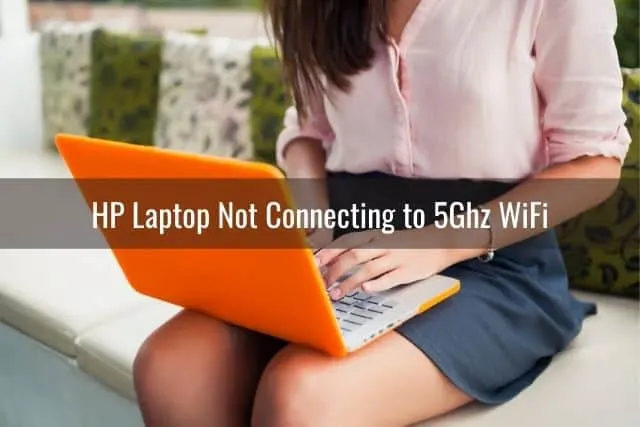 Business woman working with laptop on her lap