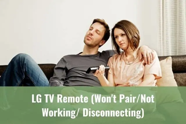 Couple sitting on sofa watching TV