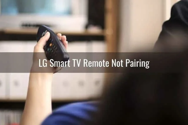Hand with TV remote