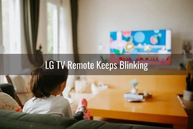 Child on sofa watching TV