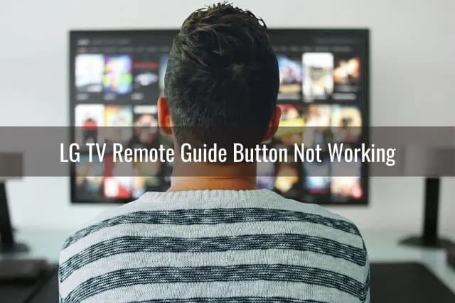 Back of male watching TV