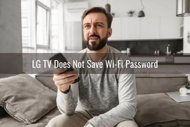 Confused male sitting on cough wondering why TV remote is not working