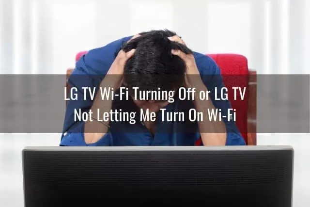 Male upset with head down in front of TV