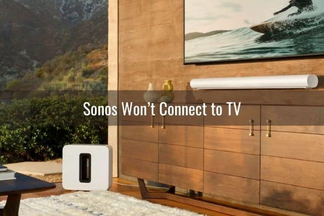 Mounted TV with sound bar speakers and subwolfer
