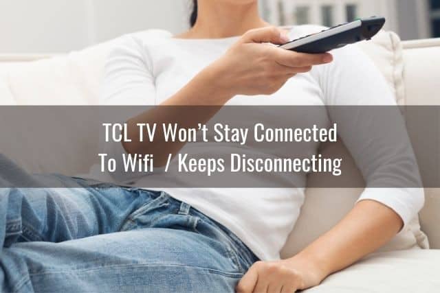 Woman using TV remote