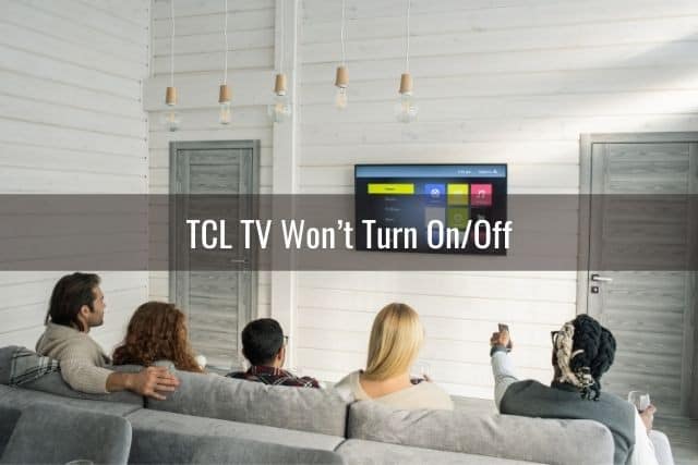 A group of friends sitting on a sofa and watching TV