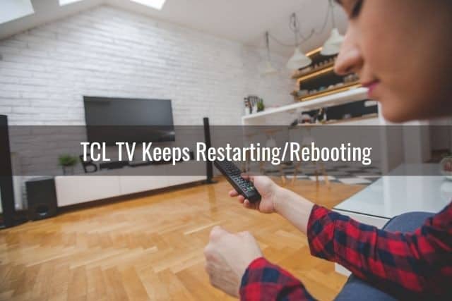 Female using remote to turn on TV