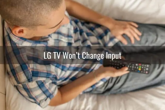 Top view of male holding TV remote