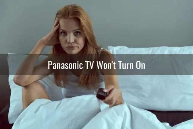 Confused female troubleshooting TV