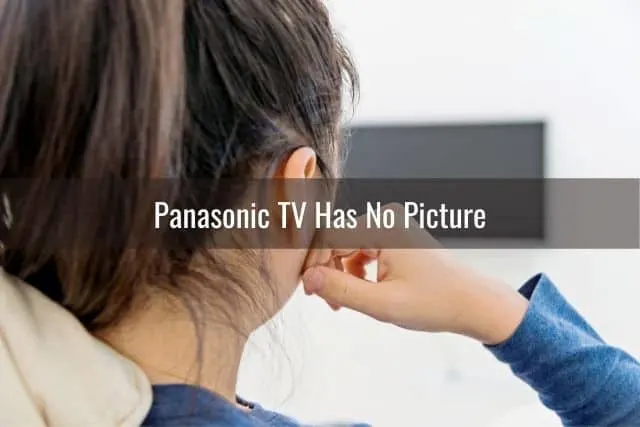 Female waiting for TV to turn on