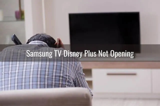 Frustrated male with head down and TV not working