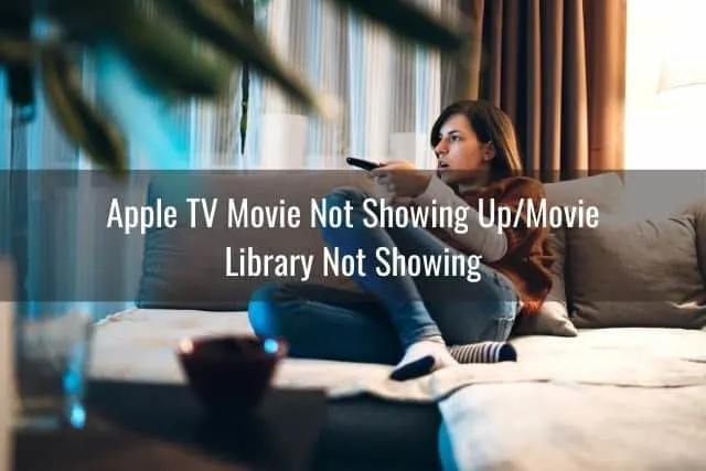 Female sitting on sofa watching TV
