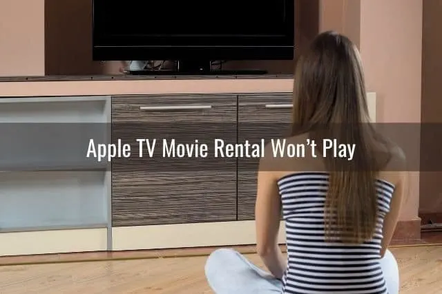 Female staring at a TV that is off