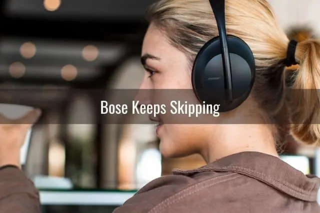 Female with headphones in cafe