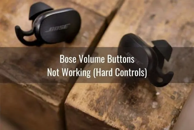 Earbud headphones sitting on wood table