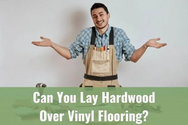 Confused carpenter with hands in air