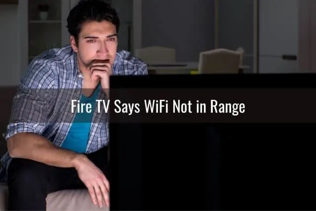 Male watching TV in the dark