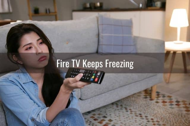 Bored female changing channels on TV