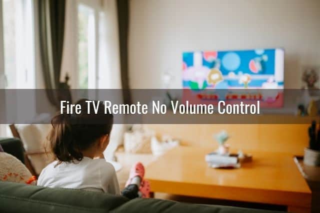 Young female in living room watching TV