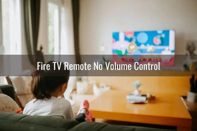 Young female in living room watching TV