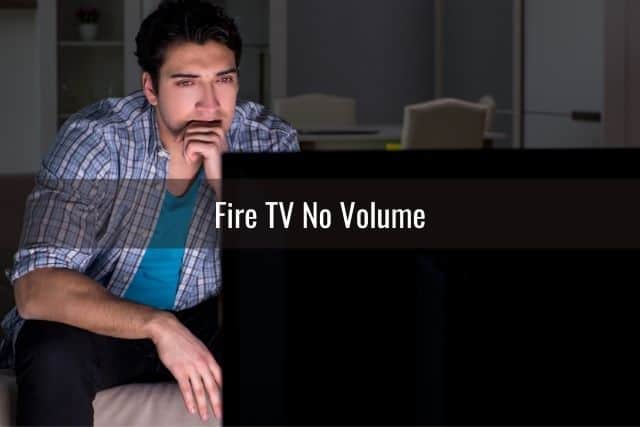 Male watching TV at night in the dark